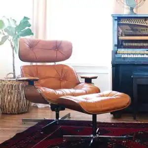 Orange recliner with leg rest